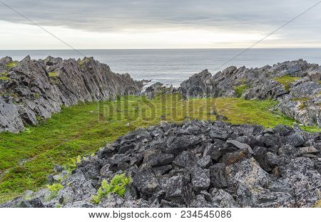 Rocky Cliffs On The Coast Of The Barents Sea, Varangerhalvoya National Park, Varanger Peninsula, Fin