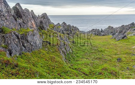 Rocky Cliffs On The Coast Of The Barents Sea, Varangerhalvoya National Park, Varanger Peninsula, Fin