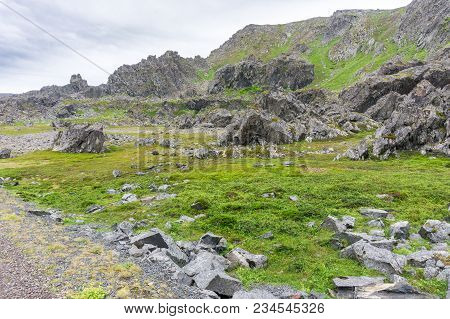 Rocky Cliffs On The Coast Of The Barents Sea, Varangerhalvoya National Park, Varanger Peninsula, Fin