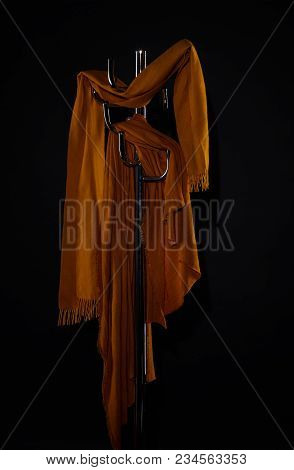 Clothes Hanging On Coat Rack Isolated On Black
