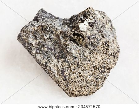 Macro Shooting Of Natural Mineral Rock Specimen - Rough Peridotite Stone With Phlogopite Mica On Whi