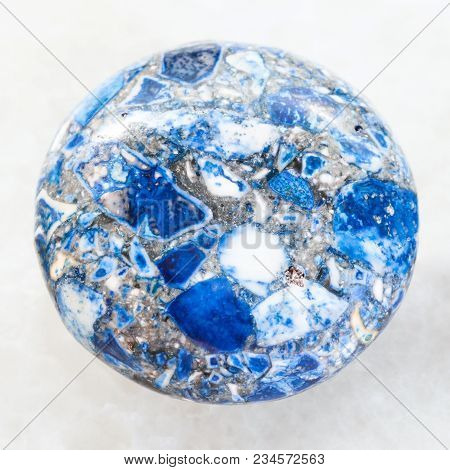 Macro Shooting Of Mineral Rock Specimen - Cabochon From Artificial Pressed Lazurite Stone On White M