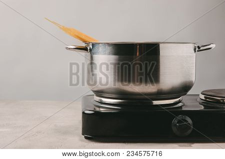 Close-up Shot Of Spaghetti Boiling In Stewpot On Concrete Tabletop