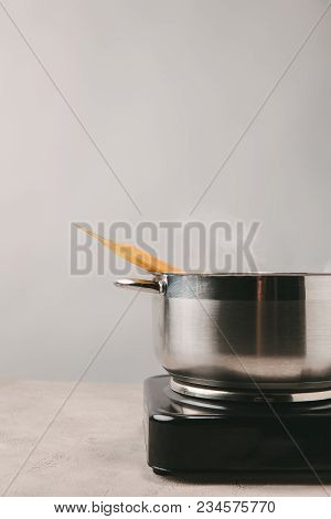 Delicious Spaghetti Boiling In Stewpot On Concrete Tabletop