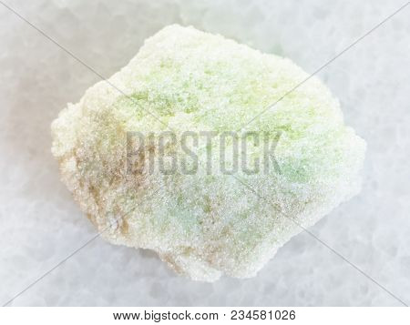Macro Shooting Of Natural Mineral Rock Specimen - Raw Lavrovite Stone On White Marble Background Fro