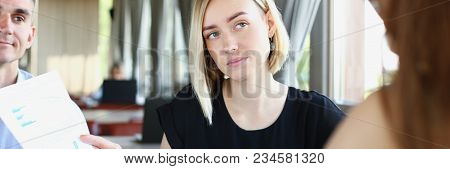 Businessmen Stady Documents In Cafe. Discuss Chart Report