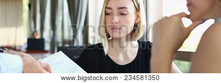 Businessmen Stady Documents In Cafe. Discuss Chart Report