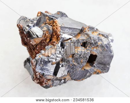 Macro Shooting Of Natural Mineral Rock Specimen - Raw Galenite Stone On White Marble Background