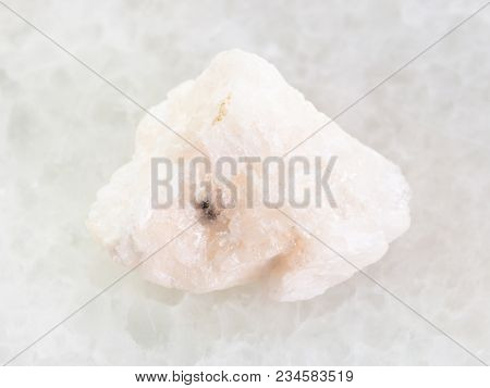 Macro Shooting Of Natural Mineral Rock Specimen - Rough Barite Stone On White Marble Background
