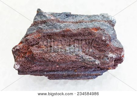 Macro Shooting Of Natural Mineral Rock Specimen - Raw Jaspilite (ferruginous Quartzite) Stone On Whi