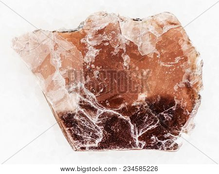 Macro Shooting Of Natural Mineral Rock Specimen - Rough Brown Mica Lamina On White Marble Background