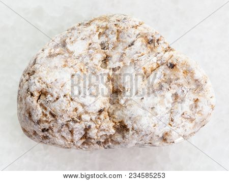 Macro Shooting Of Natural Mineral Rock Specimen - White Granite Stone On White Marble Background