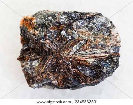 Macro Shooting Of Natural Mineral Rock Specimen - Rough Lamprophyllite Stone On White Marble Backgro