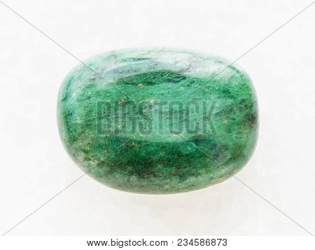 Macro Shooting Of Natural Mineral Rock Specimen - Polished Green Beryl Gemstone On White Marble Back