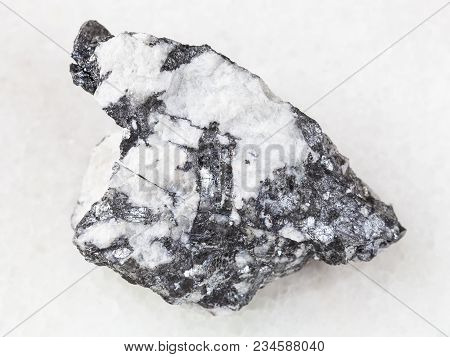 Macro Shooting Of Natural Mineral Rock Specimen - Bismuthinite Vein In Rough Quartz Stone On White M