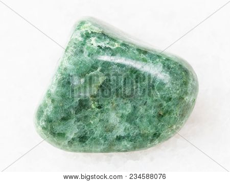 Macro Shooting Of Natural Mineral Rock Specimen - Polished Green Jadeite Gemstone On White Marble Ba