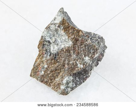 Macro Shooting Of Natural Mineral Rock Specimen - Raw Andesite Stone On White Marble Background