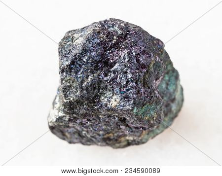 Macro Shooting Of Natural Mineral Rock Specimen - Pebble Of Bornite Stone On White Marble Background