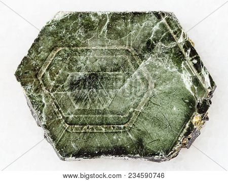 Macro Shooting Of Natural Mineral Rock Specimen - Raw Phlogopite Mica Stone On White Marble Backgrou
