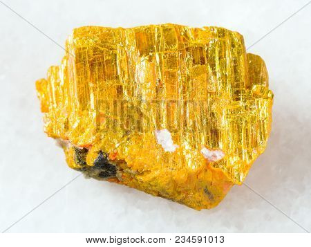 Macro Shooting Of Natural Mineral Rock Specimen - Raw Native Orpiment Stone On White Marble Backgrou