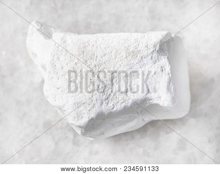 Macro Shooting Of Natural Mineral Rock Specimen - Chalk Stone On White Marble Background