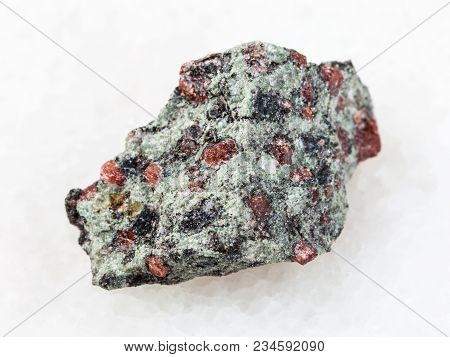 Macro Shooting Of Natural Mineral Rock Specimen - Rough Eclogite Stone On White Marble Background Fr
