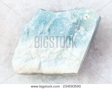 Macro Shooting Of Natural Mineral Rock Specimen - Rough Blue Violane Stone On White Marble Backgroun
