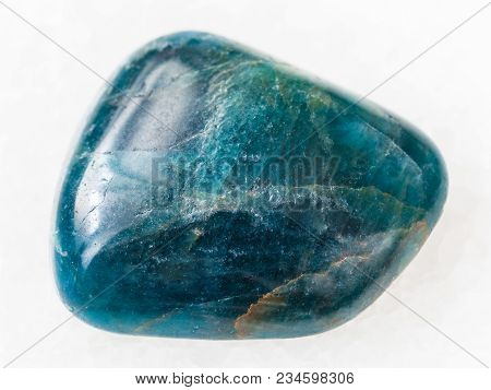 Macro Shooting Of Natural Mineral Rock Specimen - Polished Green Blue Apatite Gemstone On White Marb