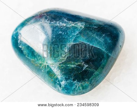 Macro Shooting Of Natural Mineral Rock Specimen - Tumbled Green Blue Apatite Gemstone On White Marbl