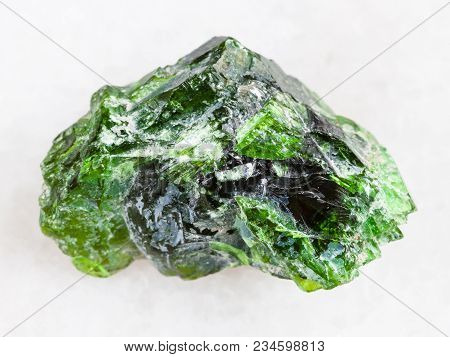 Macro Shooting Of Natural Mineral Rock Specimen - Raw Crystal Of Chrome Diopside Gemstone On White M