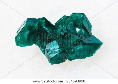 Macro Shooting Of Natural Mineral Rock Specimen - Raw Dioptase Crystal Of Gemstone On White Marble B