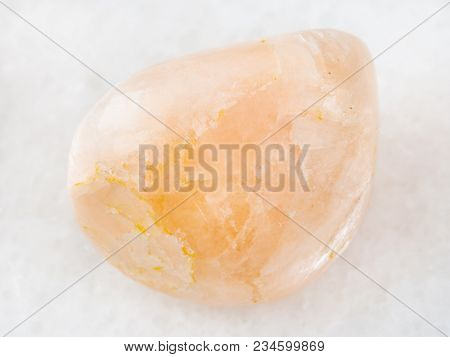 Macro Shooting Of Natural Mineral Rock Specimen - Polished Stilbite Gemstone On White Marble Backgro