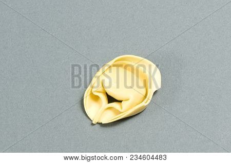 A Tortellino Pasta On A Gray Surface