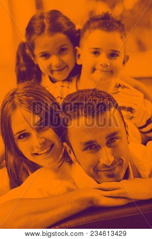 happy young family relax and have fun at modern home indooor duo tone