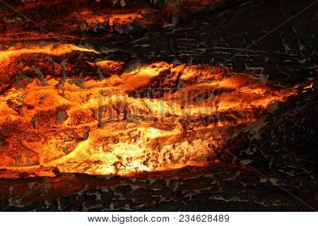 Close Up Of Fake Fireplace With Orange Backlit Log