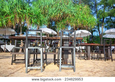 Tables with chairs on the beach