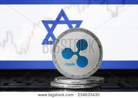 Ripple (xrp) Cryptocurrency; Physical Concept Ripple Coin On The Background Of The Flag Of Israel