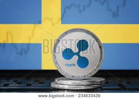 Ripple (xrp) Cryptocurrency; Physical Concept Ripple Coin On The Background Of The Flag Of Sweden (k