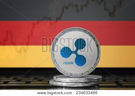 Ripple (xrp) Cryptocurrency; Physical Concept Ripple Coin On The Background Of The Flag Of Germany