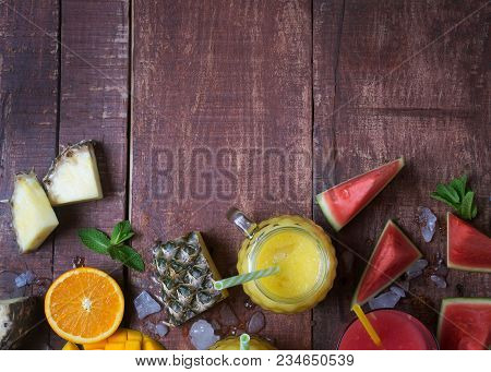 Fresh Multifruit Smoothie In A Glass With Fruits On A Brown Wooden Rustic Background, Flat Lay. Fres