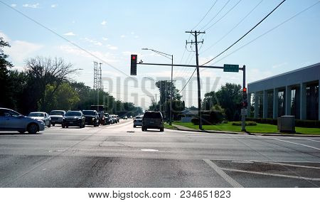 Joliet, Illinois / United States - July 27, 2017: Traffic Stops For A Red Light, At The Corner Of La