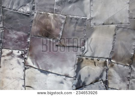 Silver Metallic Background. Metal Patches. Texture Of Old Metal With Rivets. Abstract Metallic Block