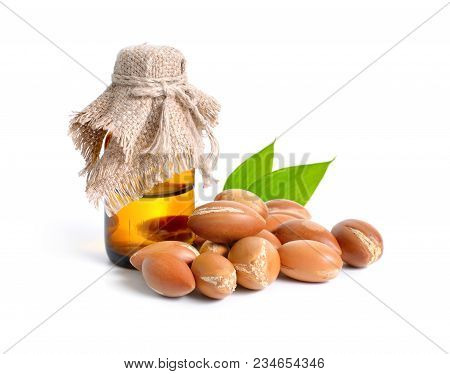 Argan Seed  With Pharmaceutical Bottle. Isolated  On White Background.