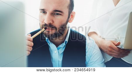 Bearded Young Businessman Working On Modern Office. Consultant Man Thinking Looking In Monitor Compu