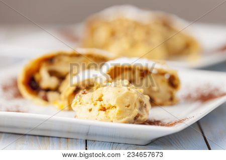 Apfelstrudel And Vanilla Ice Cream On Plates