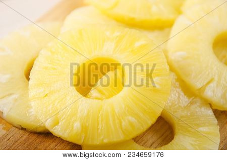 Pieces Of Pineapple. Pineapple Cut Into Pieces On A Wooden Cutting Board.