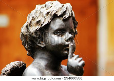 Cupid Sitting On A Stone Pedestal, Not Noise.