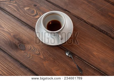 Dirty Spoon, Saucer And Cup With Remains Of Coffee On Bottom