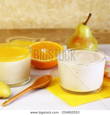 Food. Panna Cotta. Milk Fruit Berry Dessert Made Of Yogurt And Cream With Pear, Banana And Orange.