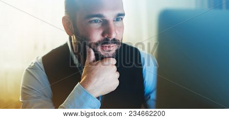 Bearded Young Businessman Working On Modern Office. Consultant Man Thinking Looking In Monitor Compu